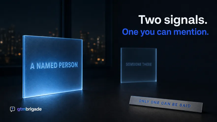 A dark desk at night lit by cold screen glow with two upright etched glass panels standing at different depths, the nearer one lit blue and legible and the further one dim and fogged