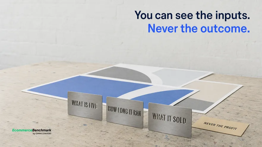 A flat overcast daylight view across a paste-up bench at eye level with three unbranded printed poster proofs laid out and three small die-cut standing steel plates set along the bench edge